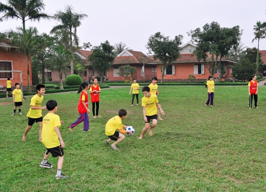Homeless children of SOS Village in Vinh playing football (Photo: Courtesy of British Council)